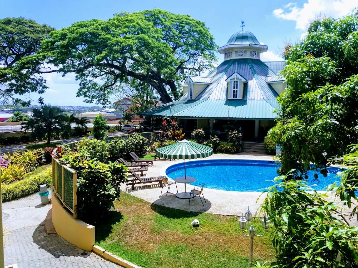 The Royal Hotel pavilion with its green roof beside the swimming pool and gardens
