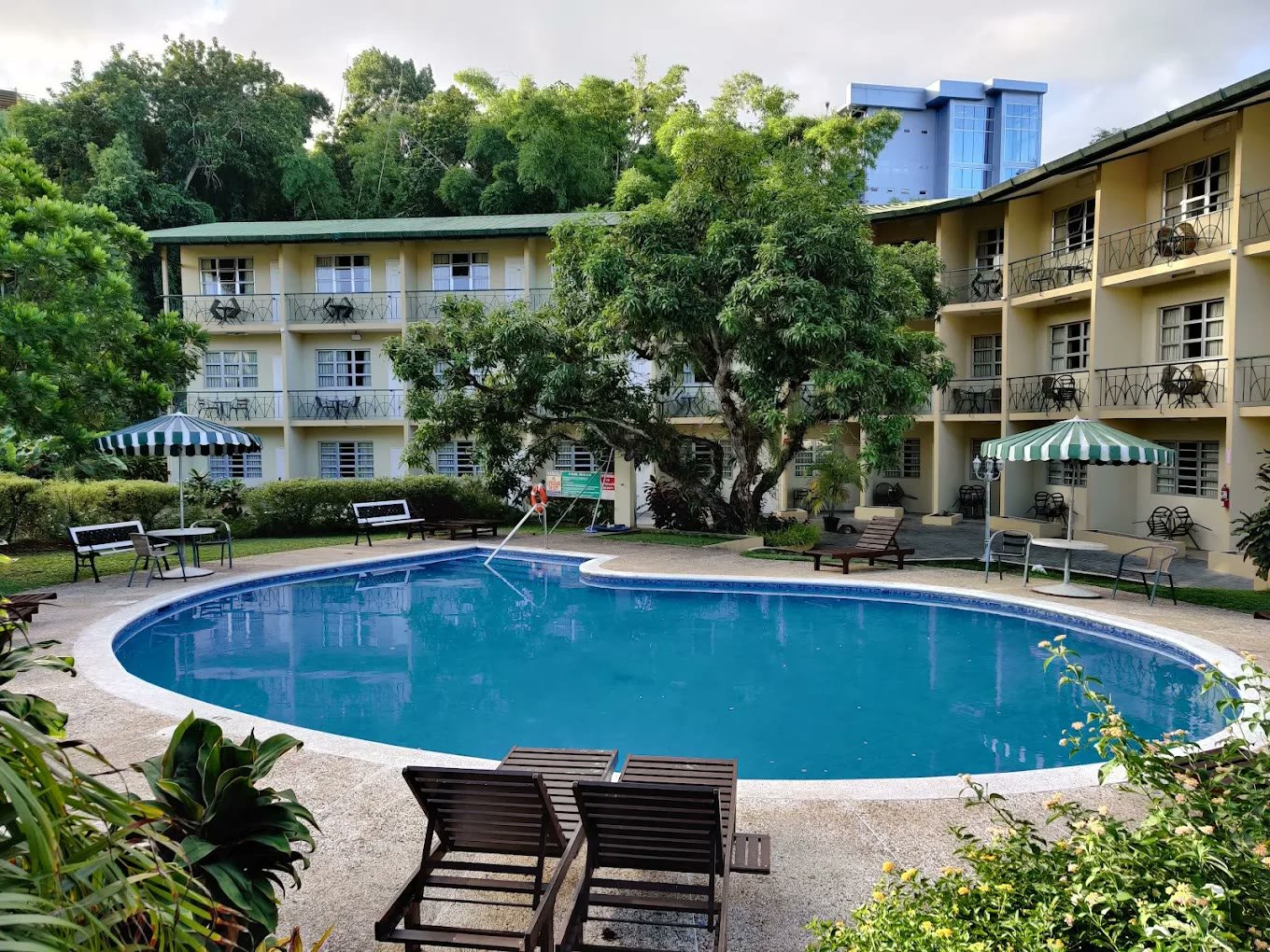 Guest wings with balconies overlooking the hotel pool